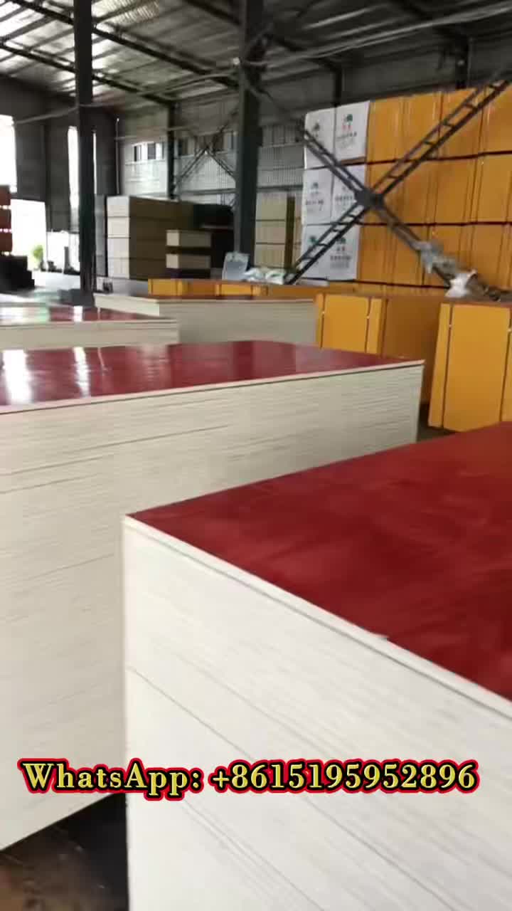 Warehouse stacked with red and white film-faced boards